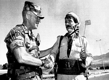 U.S. Army Major General Jay Garner, commander of the allied troops in northern Iraq, says goodbye to Mohammed Shafik Saadullah, a Kurdish guerilla member, July 15, 1991.